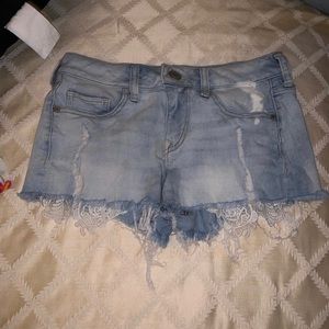 Distressed denim with lace accents shorts from express
